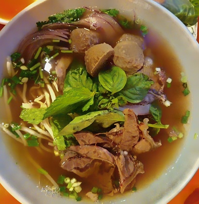 Vietnamese style noodle soup with meatballs and sliced beef.