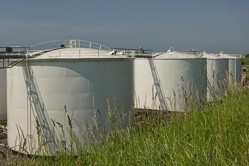 Oil storage tanks at depot in Harbour and Port at Shoreham, West Sussex, England.  No people. No logos or names.