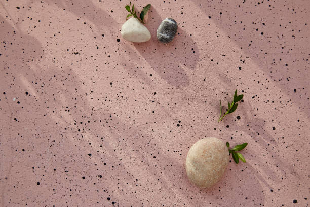 istock Minimalistic summer background with natural pebbles with shadows. Sustainable, zero waste concept. Place for your text 1555327733