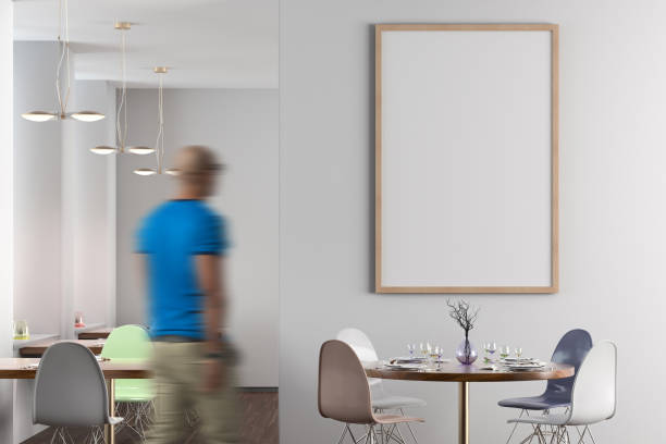 istock Cafe or restaurant interior with blank poster on the wall 1555336962
