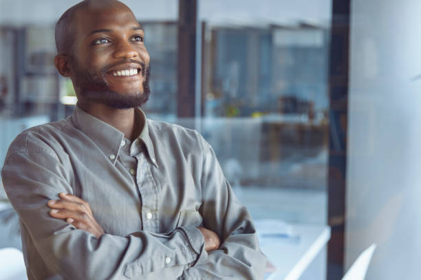 istock Glimpses of Opportunity: A Businessman's Window Reflection 1555354198