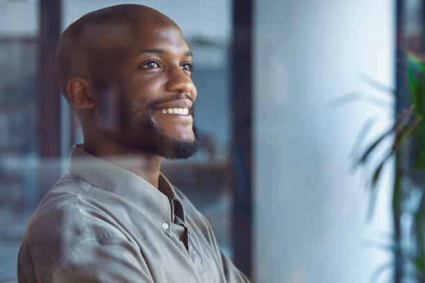 istock Glimpses of Opportunity: A Businessman's Window Reflection 1555354205