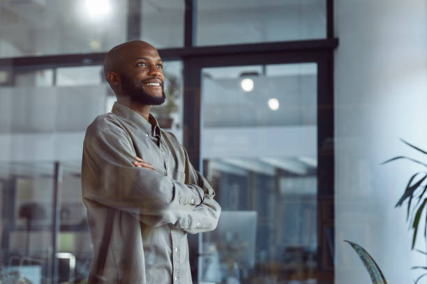 istock Glimpses of Opportunity: A Businessman's Window Reflection 1555354820