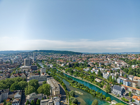 Aerial view of Swiss City of Zürich with Sihl River and Limmat River and Limmat Valley in the background on a hot sunny summer day. Photo taken July 18th, 2023, Zurich, Switzerland.