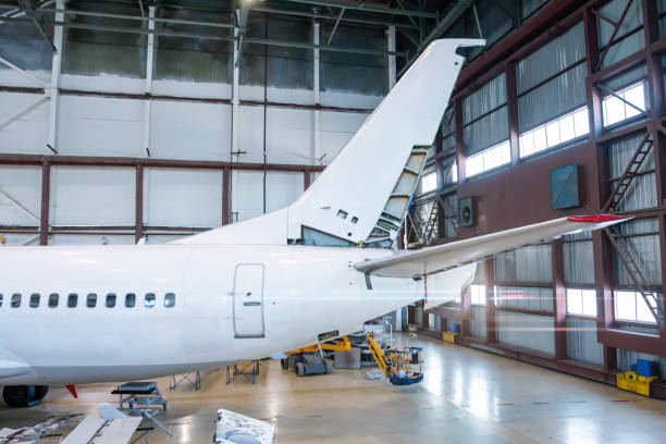 istock The back of a passenger airplane under maintenance in the hangar. Checking mechanical systems for flight operations 1555359847