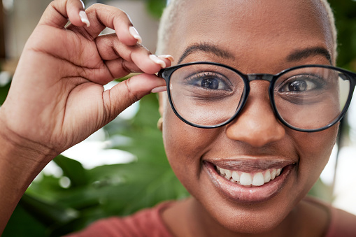 Closeup, face and black woman in glasses and vision, eye care and optometry, frame and prescription lens. Eyesight, health and ophthalmology, female person in portrait with cosmetic spectacles
