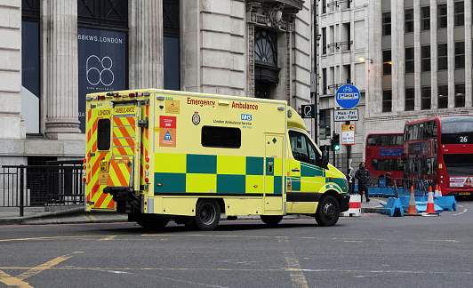 London, UK - January 29, 2023: A NHS Trust ambulance operated by London Ambulance Service responding to an emergency in central London, UK.
