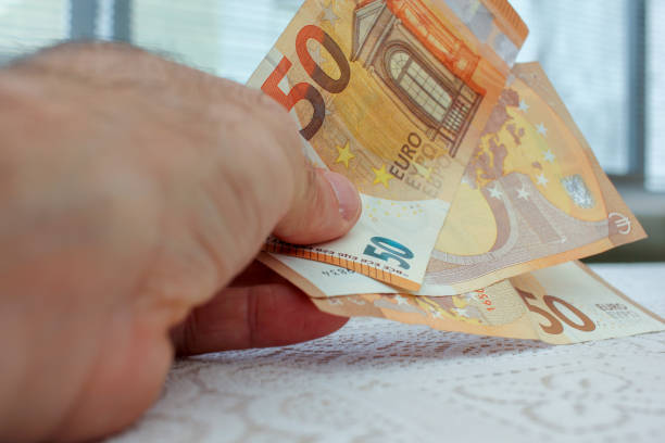 istock some fifty euro bank notes in my hand 1555401512