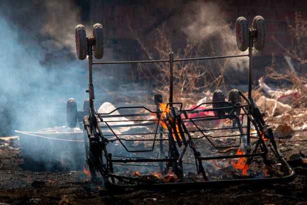 istock image of burning baby carriage. 1555430461