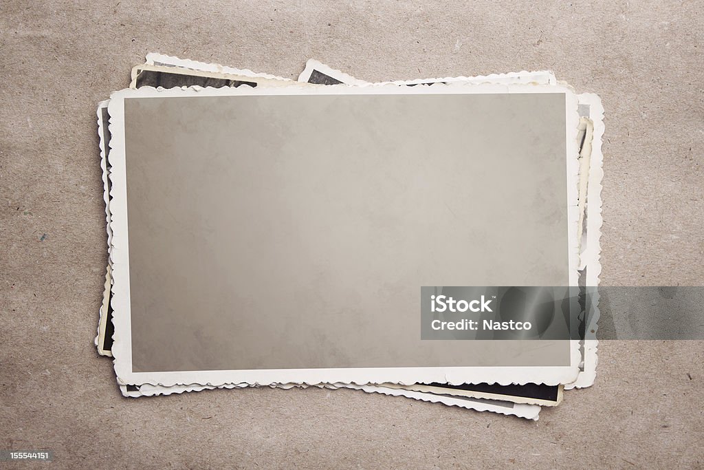 A stack of old photograph clippings Stack of blank picture frames at old recycle paper with clipping path for the inside Photograph Stock Photo