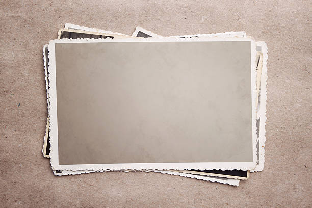A stack of old photograph clippings Stack of blank picture frames at old recycle paper with clipping path for the inside torn photos stock pictures, royalty-free photos & images