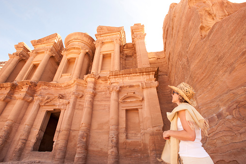 Woman traveller at ruin, Ed Deir Monastery, Petra. Jordan.