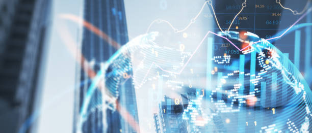 istock Wide image of office workplace with device and globe forex chart on creative blurry city backdrop. Landing page background, trade, success and finance concept. Double exposure. 1555450130