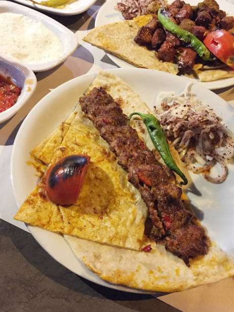 istock Turkish kebab and liver ciger kebab on the restaurant table 1555454993