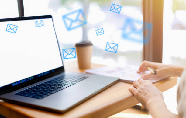 istock Women's hands close-up, work on a laptop and with papers, infographics, letters 1555457571