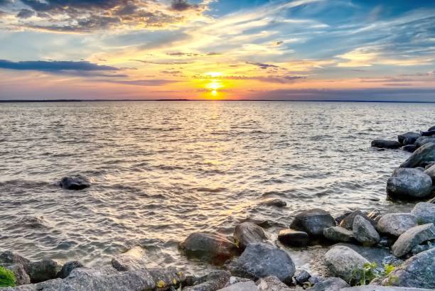 istock Summer Sunset on a Lake 1555463116