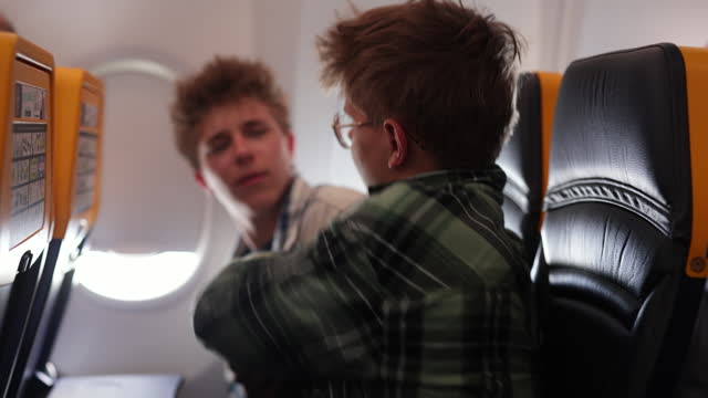 Naughty teenage kids travelling by plane