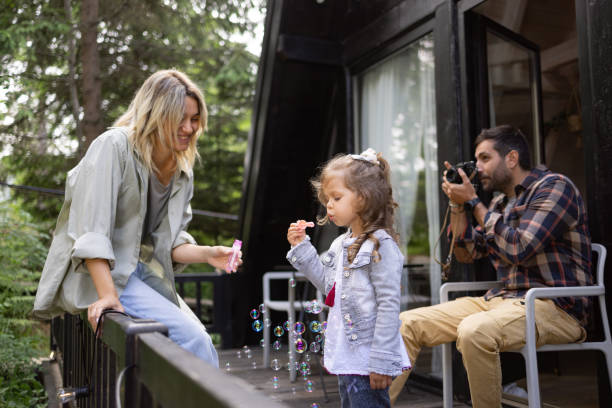istock Young family spending a day on a terrace. 1555466375