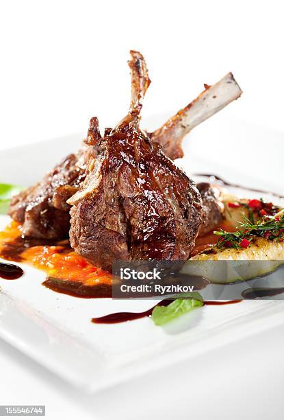 Cooked Lamb Chops With Vegetables On A White Plate Stock Photo - Download Image Now - Basil, Braised, Cooked