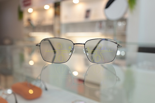 Eyeglass progressive lens, glasses in optical shop