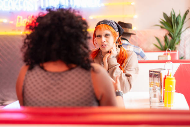 istock Friends in a traditional American diner 1555507565