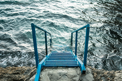 Blue metal stairs to the Adratic sea. Albatros, Ulcinj, Crna Gora