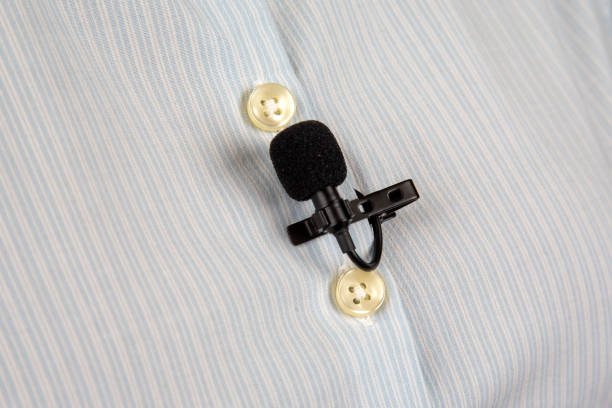 istock lavalier microphone for voice recording on the shirt. audio device technology. wired small microphone 1555564211