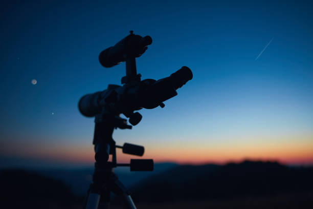 istock Astronomical telescope for observing stars, planets, Moon, celestial objects in the sky. 1555567964