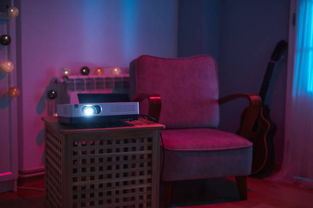 istock Home interior with movie projector. 1555572371