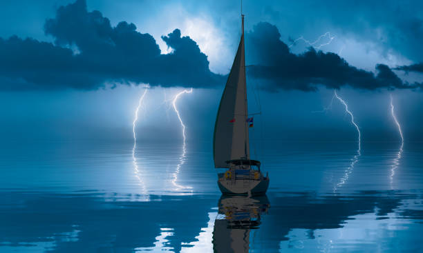 Sailboat Close to the Shore and Next to a Lighthouse with a Storm Coming