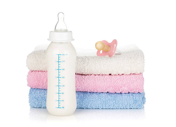istock Baby bottle, pacifier and towels 155557381