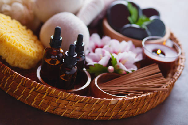 spa setting with hibiscus flowers on brown - beauty treatment