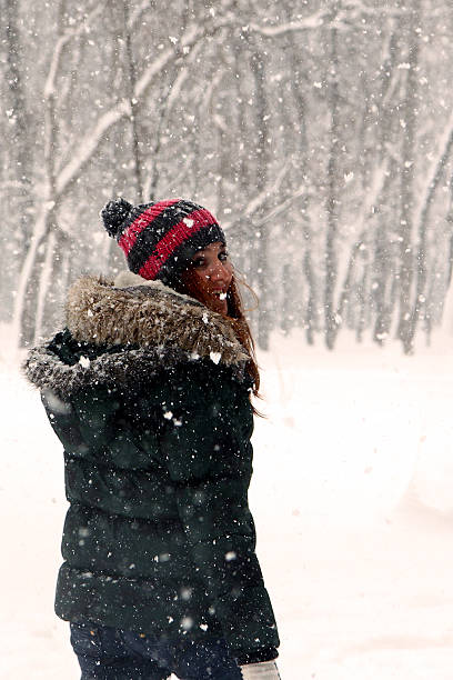 istock Beautiful Young Woman posing in Snow 155564783