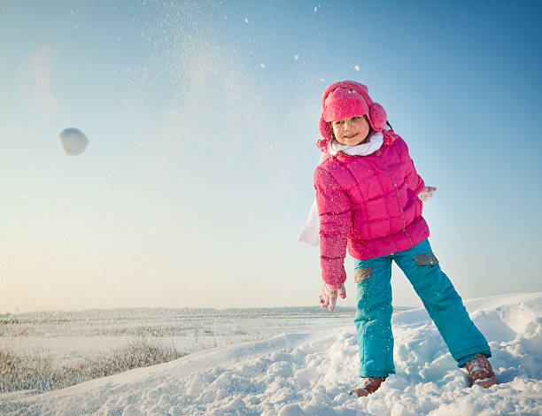 istock Little child playing in snow 155565314