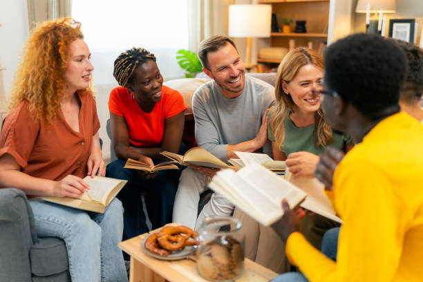 istock Bible group sitting in a circle reading a passage together 1555681448