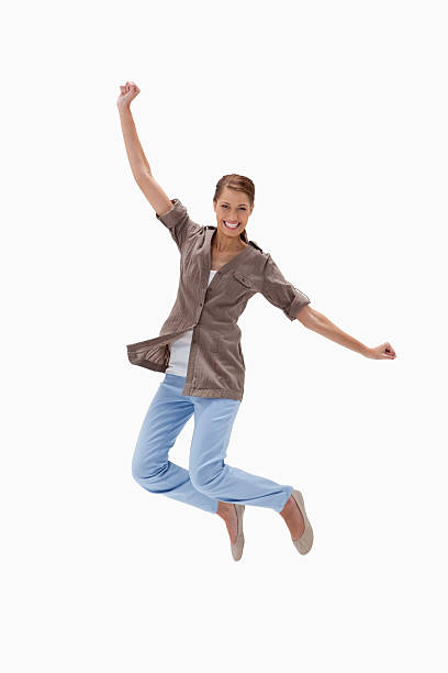 istock Smiling woman jumping 155568148