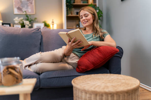 istock Woman enjoying a book 1555681977