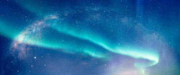 istock Our galaxy is Milky way spiral galaxy with aurora borealis 1555685669