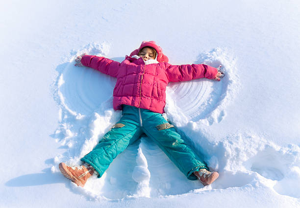 istock Little child playing in snow 155569101