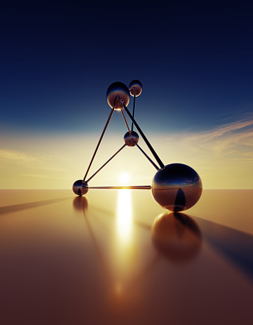 Connected spheres at sunset. Vertical composition with copy space.