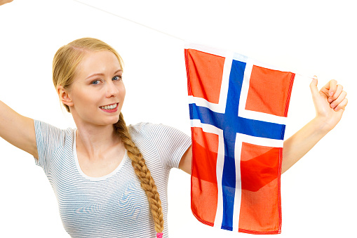 Blonde girl braid hair with norwegian flag. Scandinavian people.