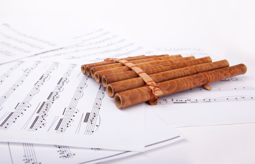 Pan flute and sheet music