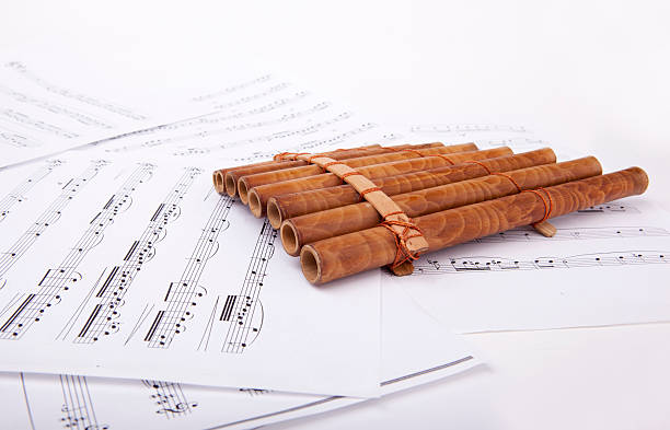 pan flute and sheet music stock photo