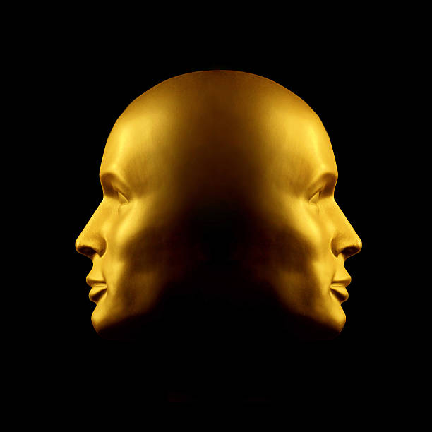 deux faces statue tête d'or - balefire photos et images de collection