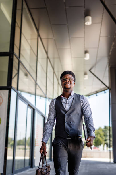 istock Successful businessman walking 1555727415