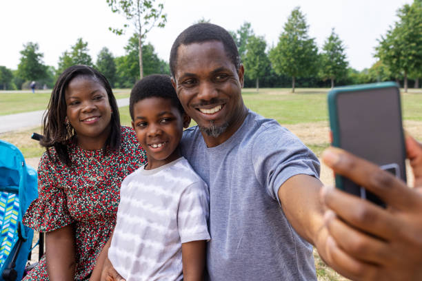 istock Taking a Family Selfie in The Park 1555745341