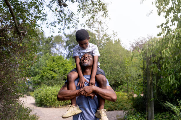 istock Shoulder Carrys in the Park 1555745852