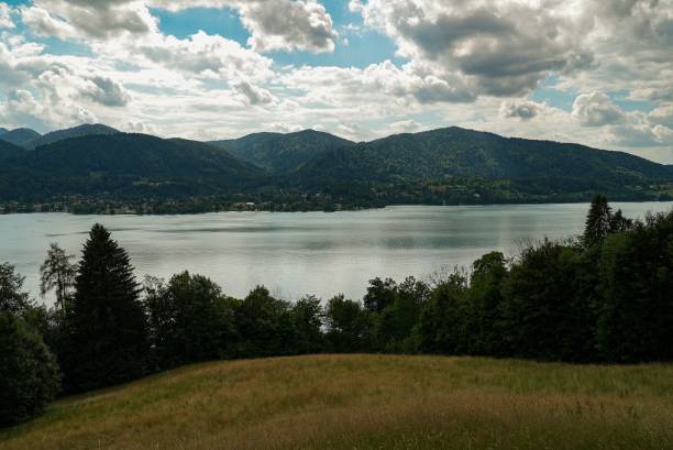 istock Tranquil landscape featuring Tegernsee Lake with mountains in the distance. Germany. 1555753640