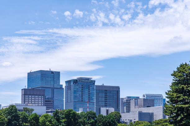istock Beautiful blue sky and city buildings 1555759400