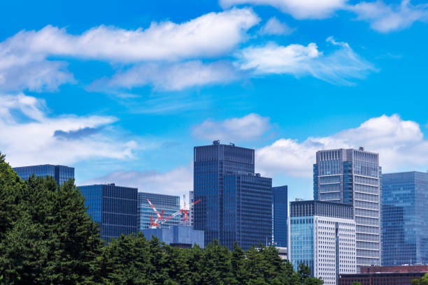 istock Beautiful blue sky and city buildings 1555768801